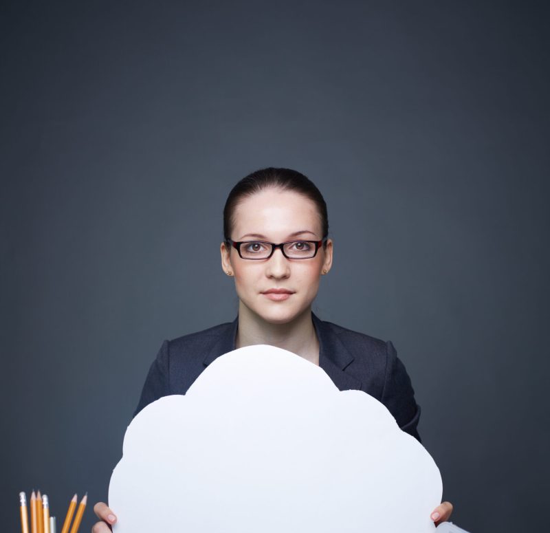 Image of pretty businesswoman in eyeglasses holding blank paper speech bubble